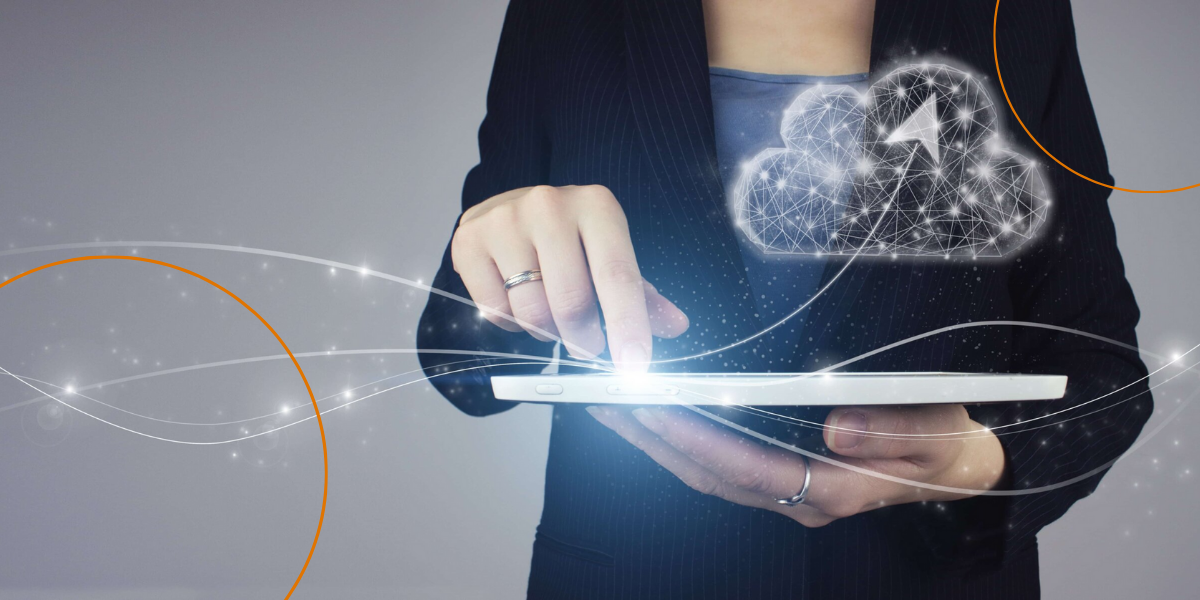 A woman clicks on a tablet to reveal a digitized cloud