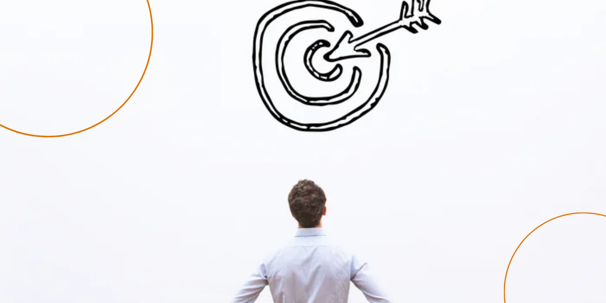 A man stares up a drawn bullseye