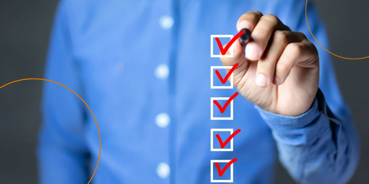 A man in a blue shirt checks a box with a red checkmark