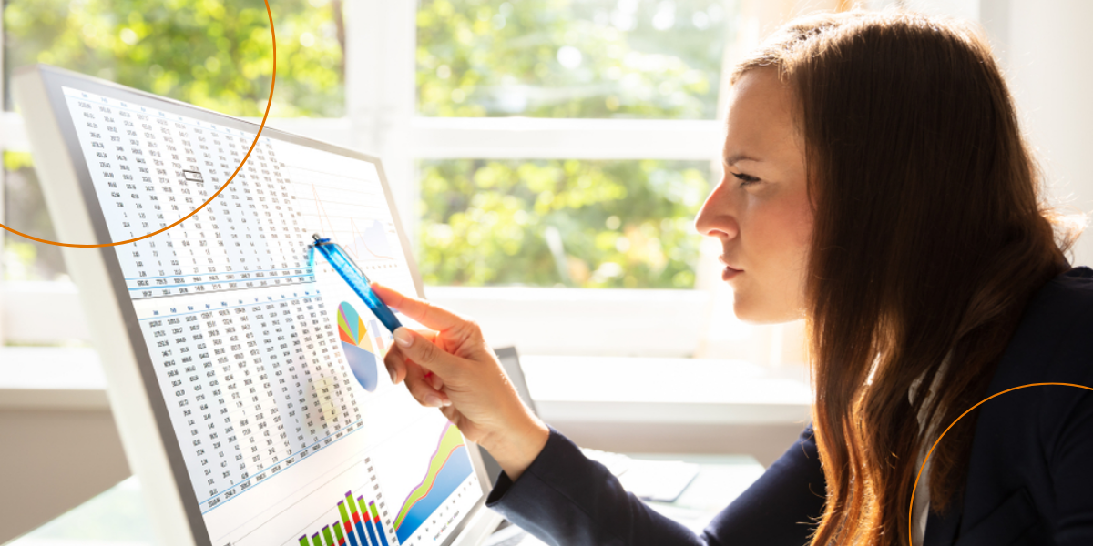 A young businesswoman analyzes a graph closely